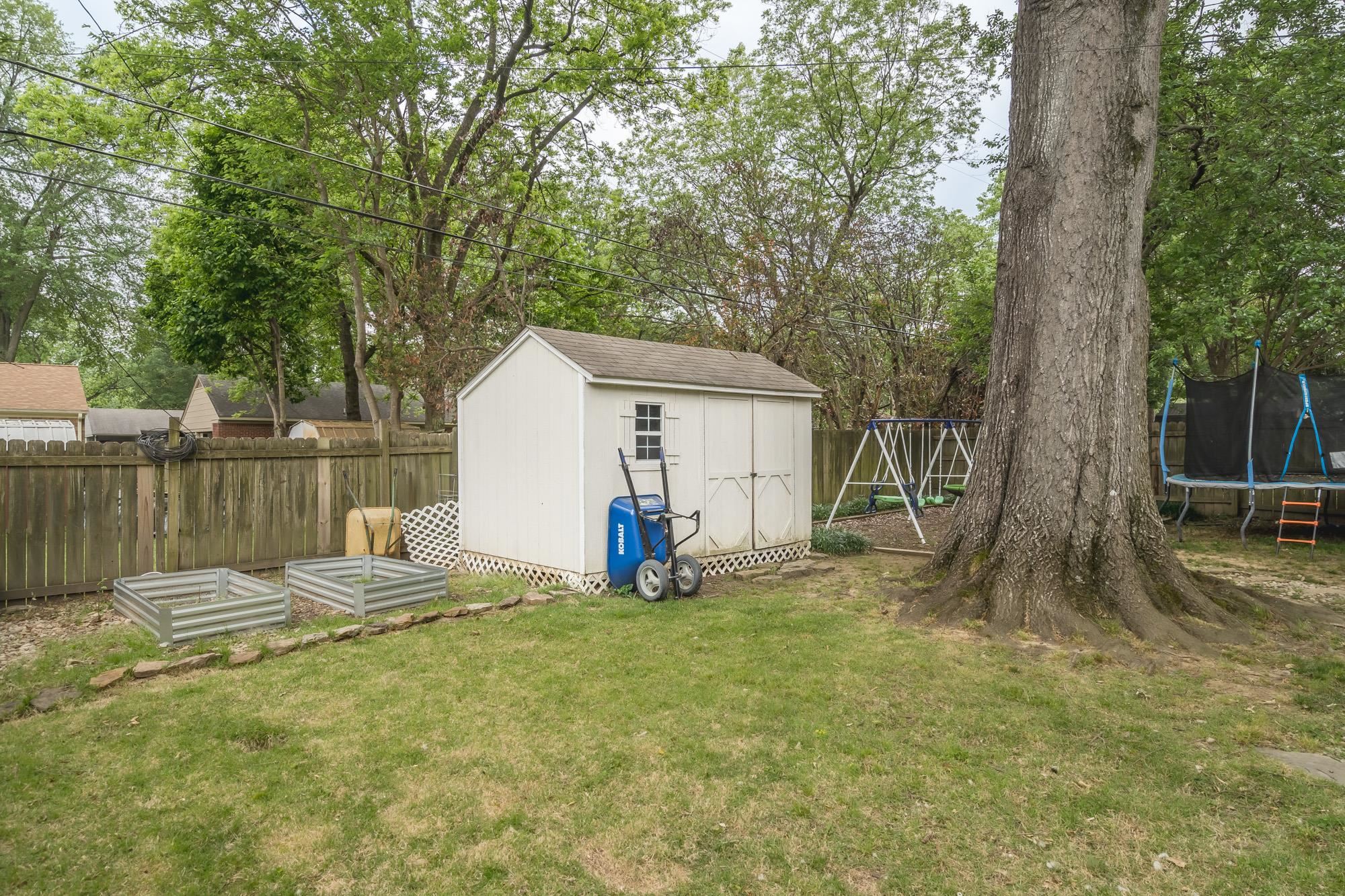 5003 Sequoia Road Memphis, TN 38117 - Photo 14 of 15 a view of backyard with tree