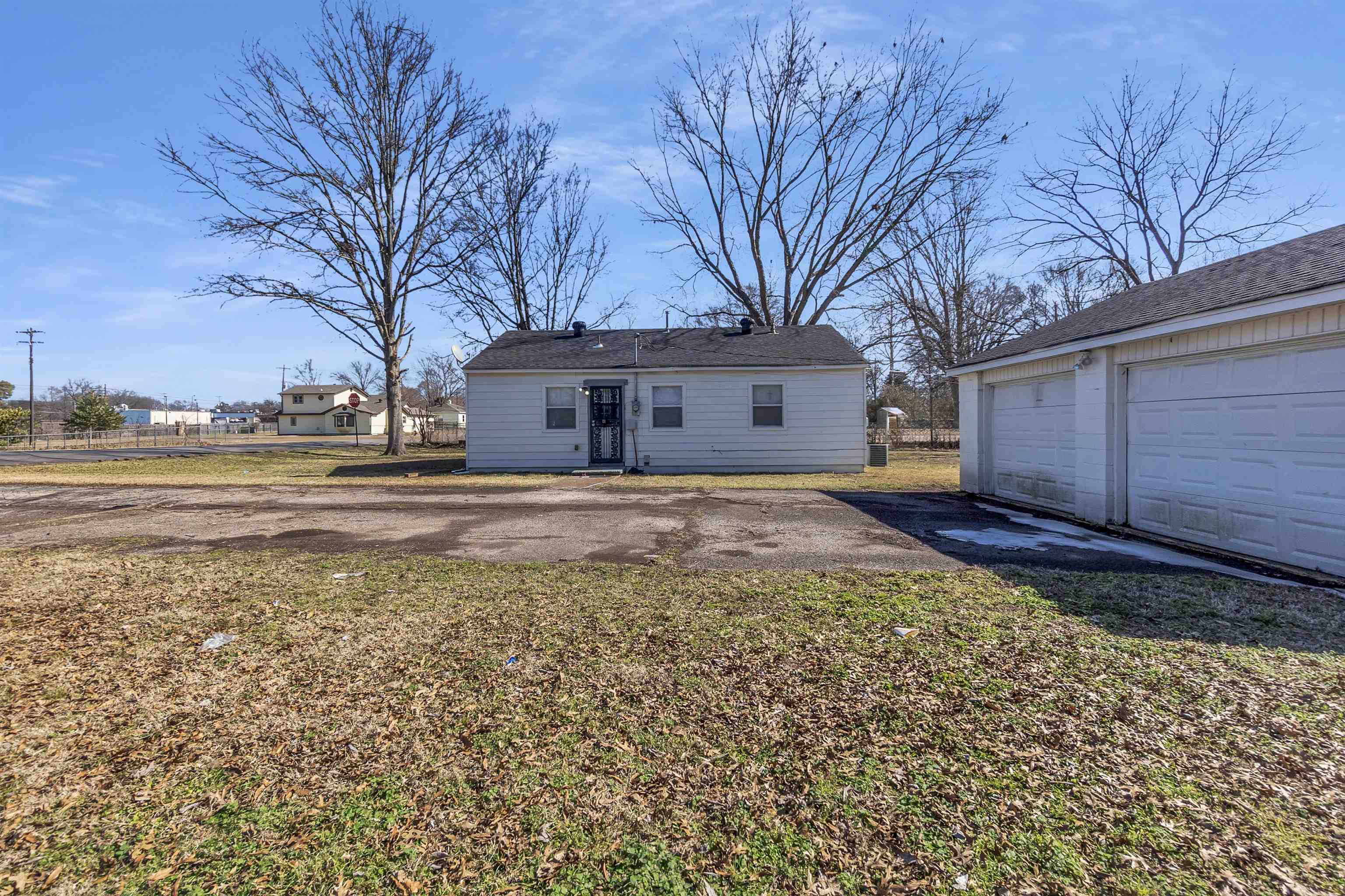 7821 Newport Road Millington, TN 38053 - Photo 11 of 18 Rear view of property featuring a patio area, an outbuilding, and a yard