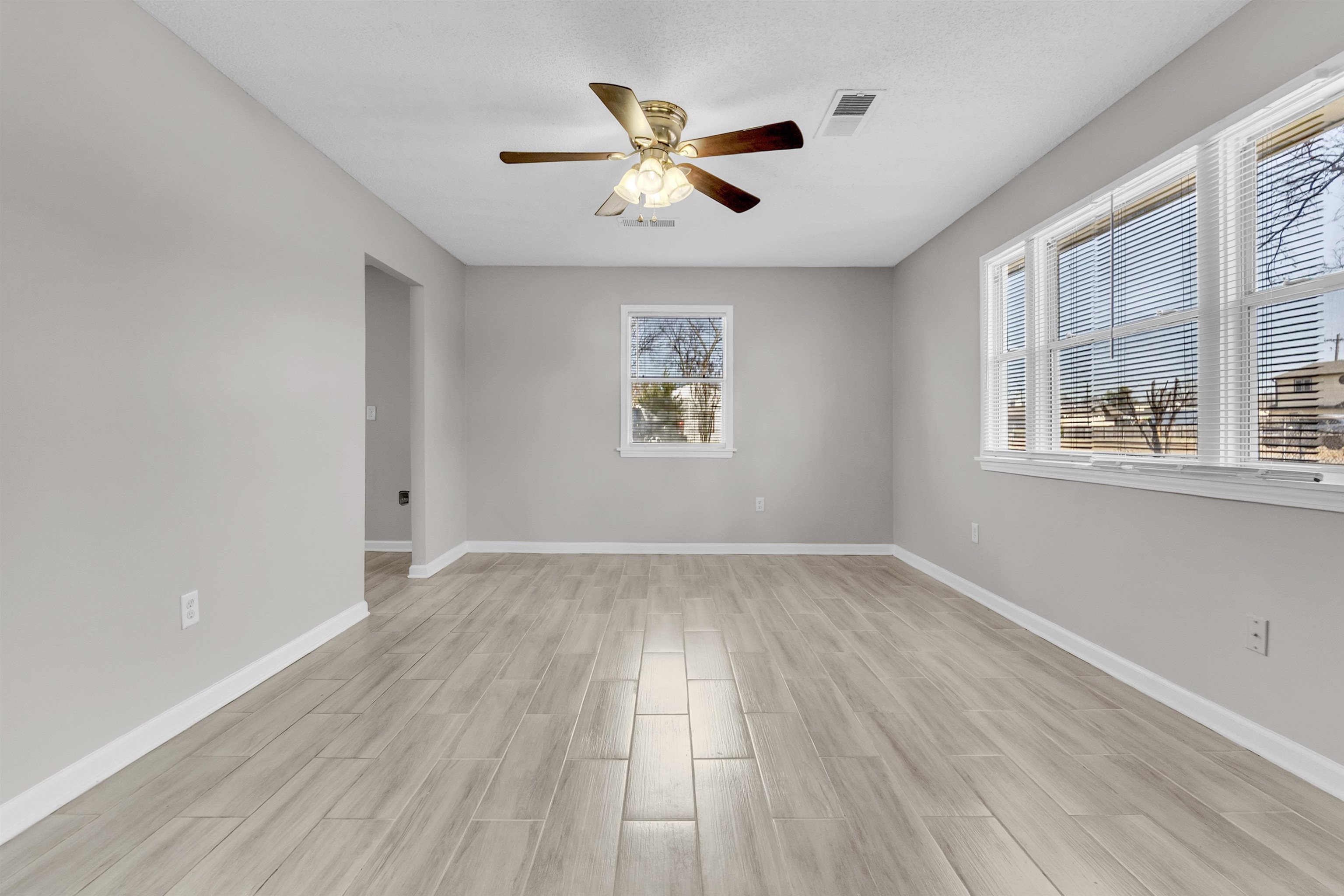 7821 Newport Road Millington, TN 38053 - Photo 12 of 18 Unfurnished room with wood tiled floors and a ceiling fan