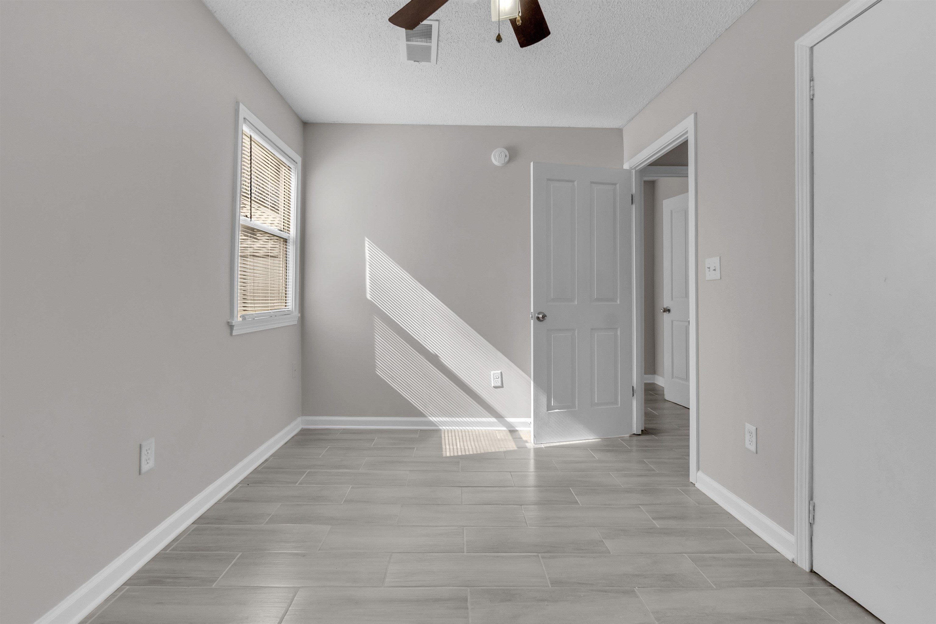 7821 Newport Road Millington, TN 38053 - Photo 15 of 18 Empty room with ceiling fan and a textured ceiling