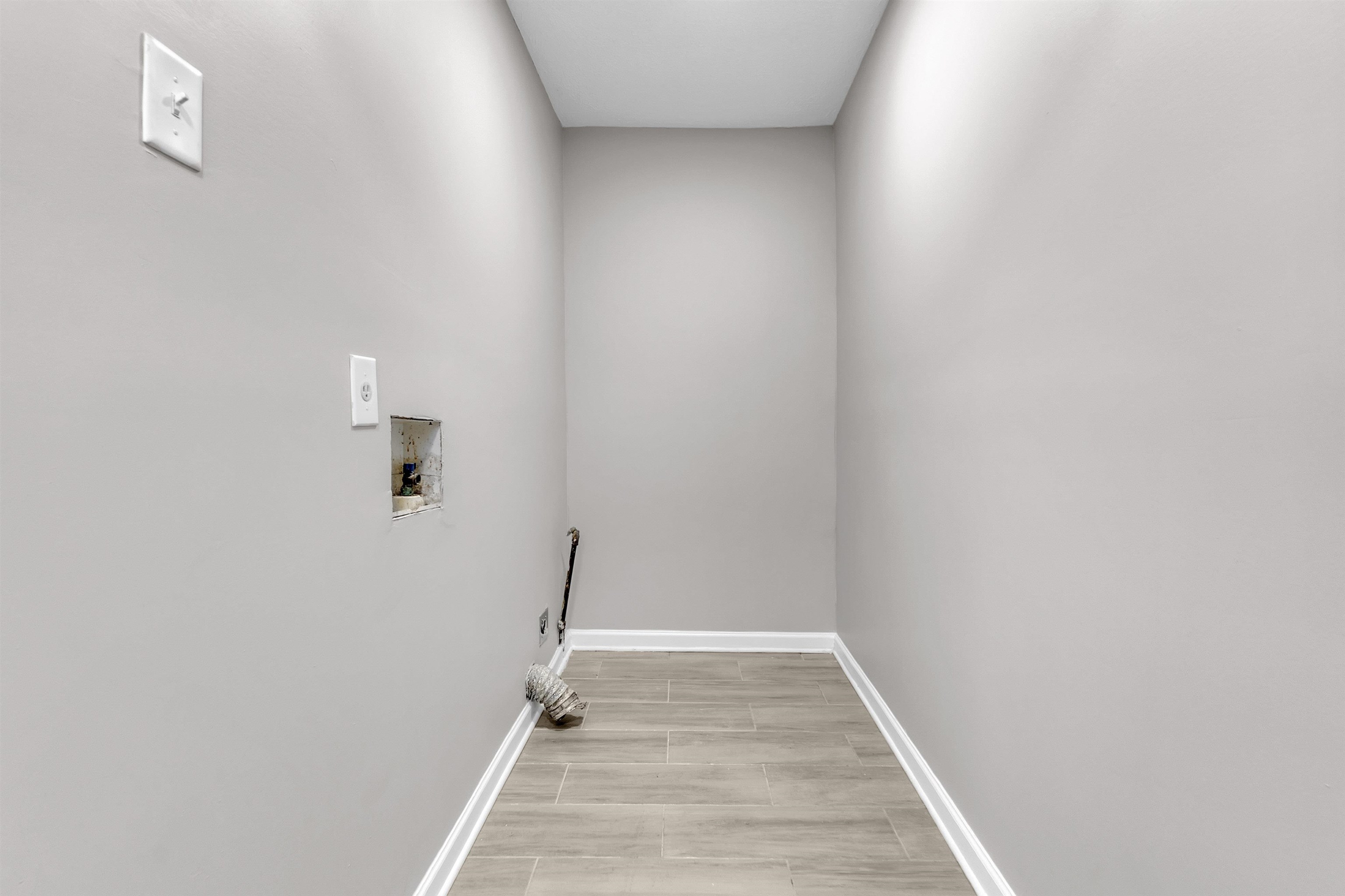 7821 Newport Road Millington, TN 38053 - Photo 17 of 18 Laundry area with hookup for a washing machine and wood finish floors