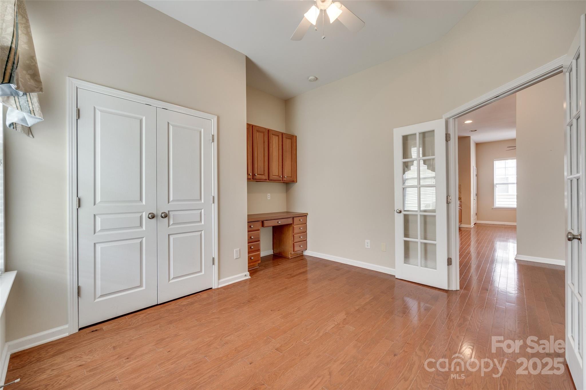 1033 Knob Creek Lane Tega Cay, SC 29708 - Photo 17 of 45 an empty room with windows cabinet and fire place
