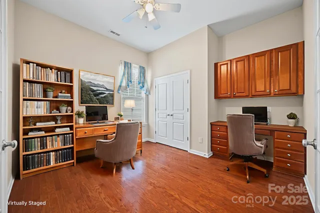 a room with furniture cabinets and window