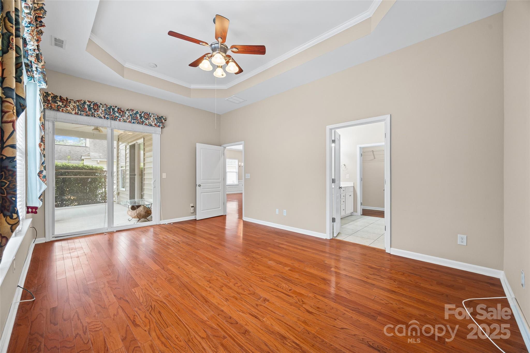 1033 Knob Creek Lane Tega Cay, SC 29708 - Photo 22 of 45 a view of an empty room with wooden floor and a window