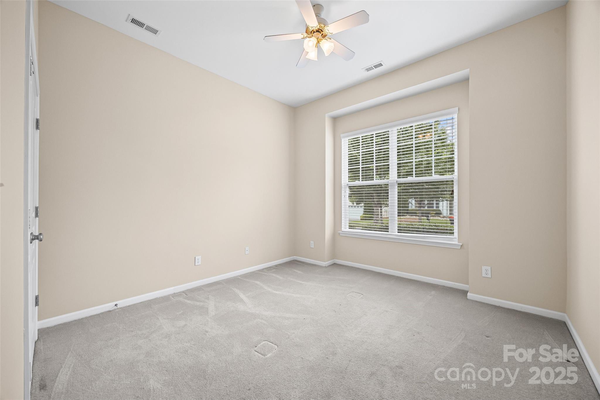 1033 Knob Creek Lane Tega Cay, SC 29708 - Photo 26 of 45 an empty room with a window