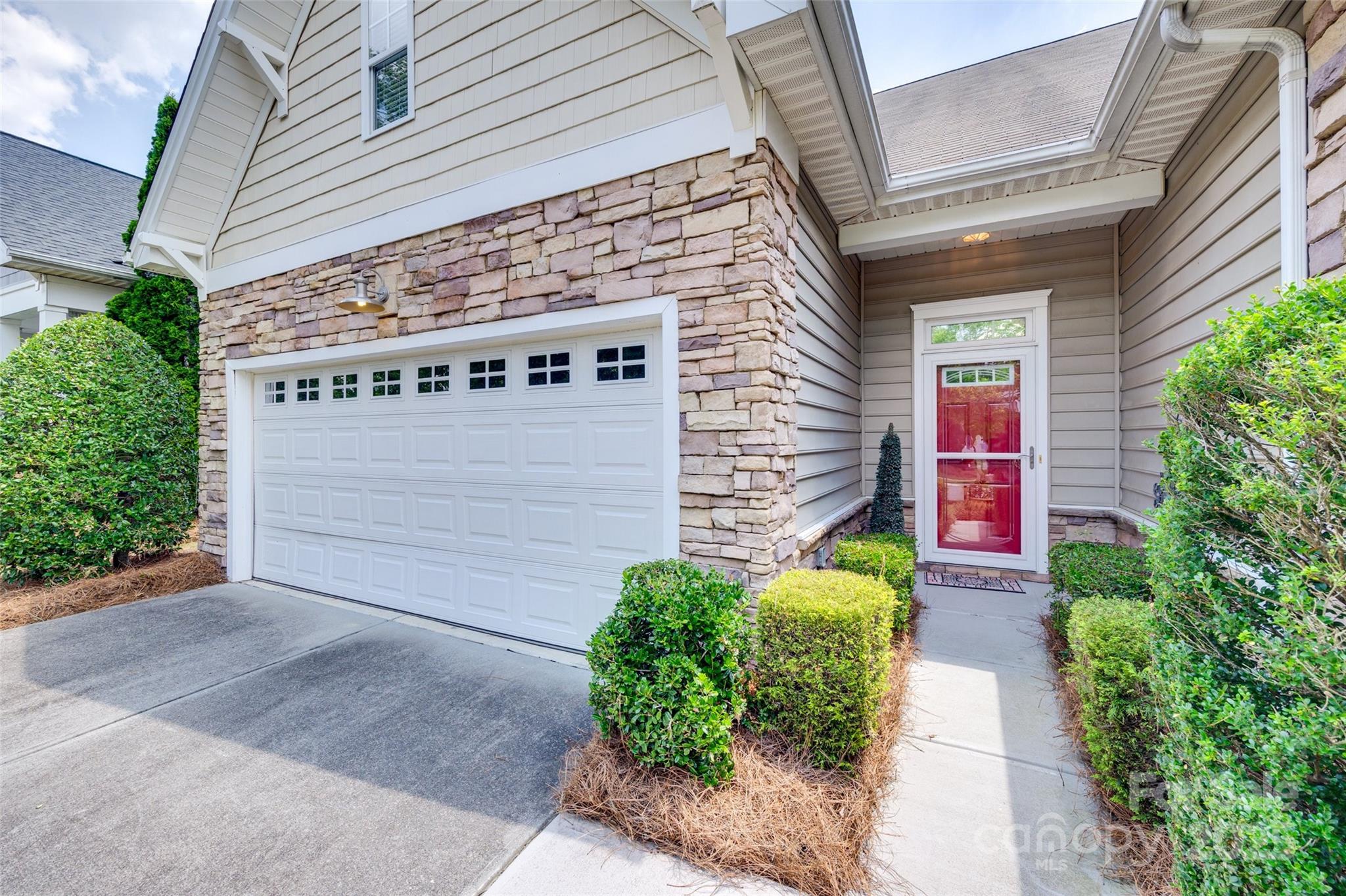 1033 Knob Creek Lane Tega Cay, SC 29708 - Photo 3 of 45 a view of a pathway along the building