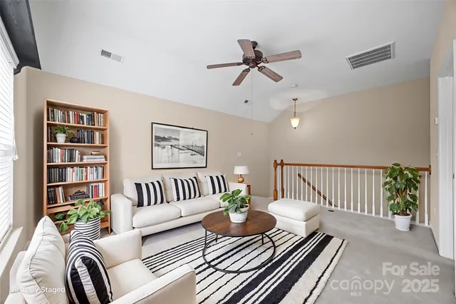 a view of a room with a ceiling fan