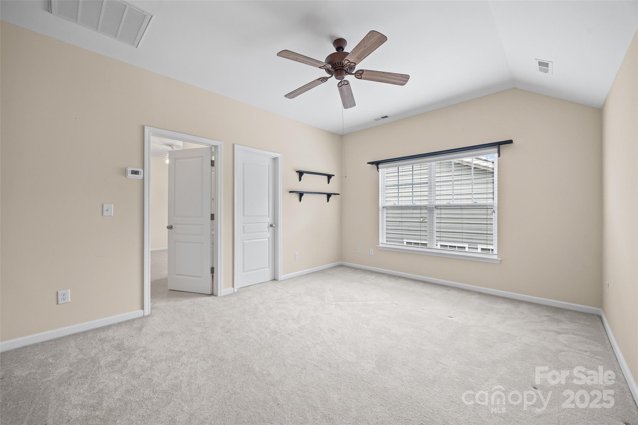 1033 Knob Creek Lane Tega Cay, SC 29708 - Photo 33 of 45 a view of an empty room with a window