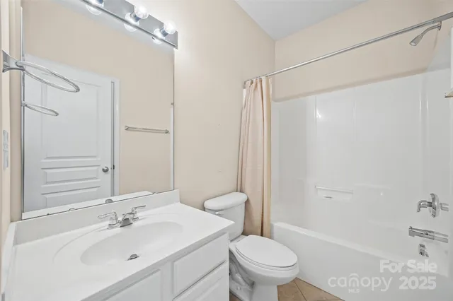 a view of a building with a large window and a porch