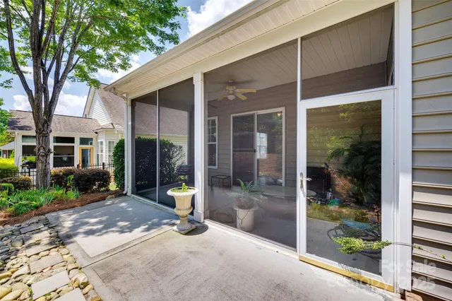 a view of a room with a porch and furniture