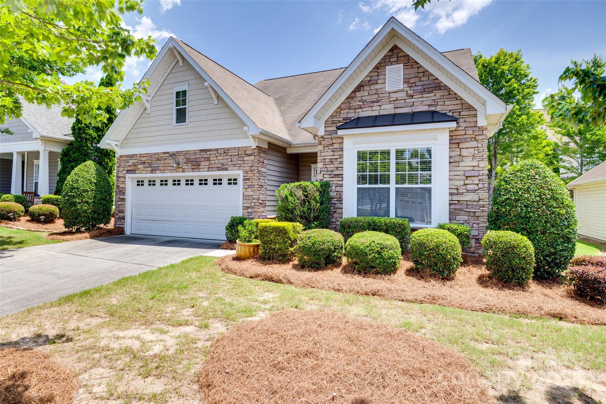1033 Knob Creek Lane Tega Cay, SC 29708 - Photo 45 of 45 a front view of a house with a yard and outdoor seating