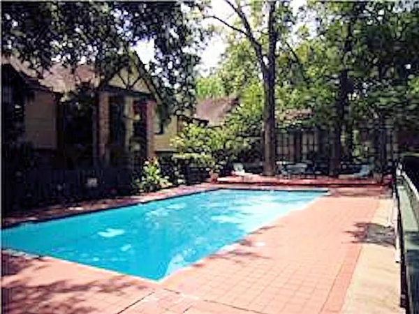 a view of swimming pool with patio