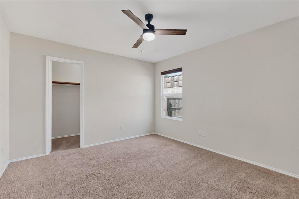 5516 McClelland Street Forney, TX 75126 - Photo 16 of 36 Unfurnished bedroom featuring light carpet, a spacious closet, and ceiling fan