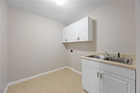 a kitchen with a sink and cabinets