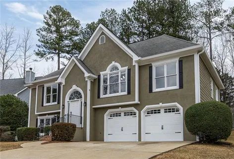 a front view of a house with a yard