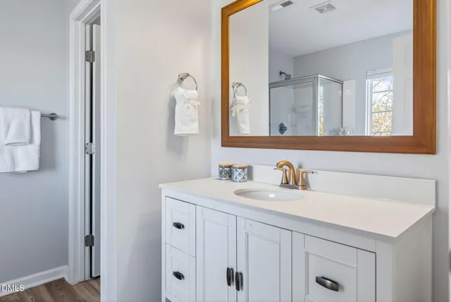 a bathroom with a bathtub and shower
