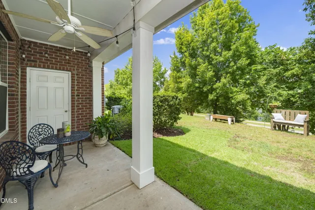 an aerial view of a house with a yard basket ball court and outdoor seating