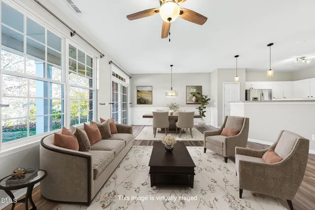 a dining room with furniture a rug and wooden floor