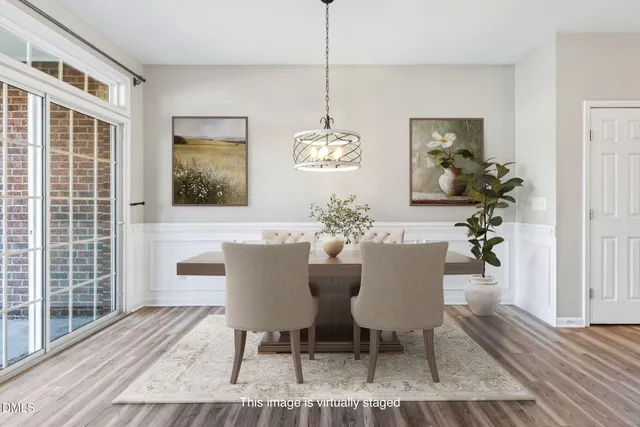 a kitchen with granite countertop white cabinets and stainless steel appliances
