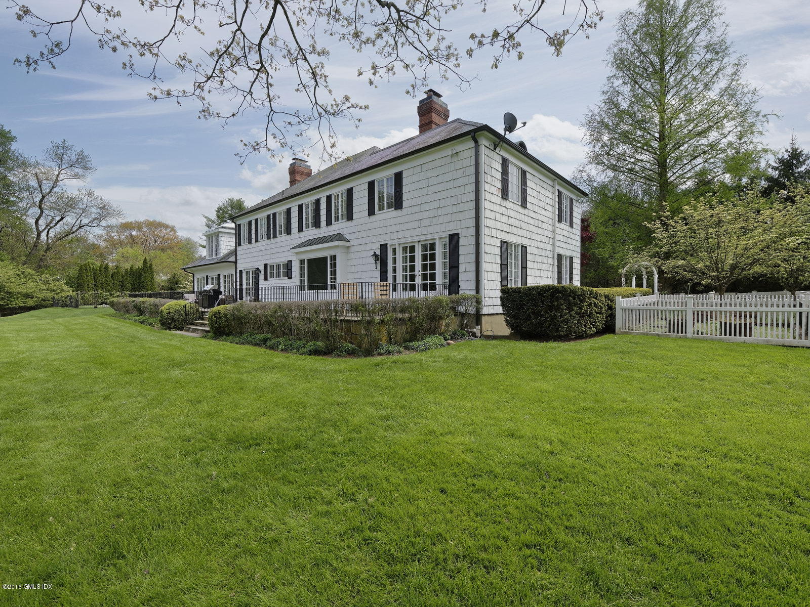 29 Lindsay Drive Greenwich, CT 06830 - Photo 13 of 17 a front view of house with yard and green space