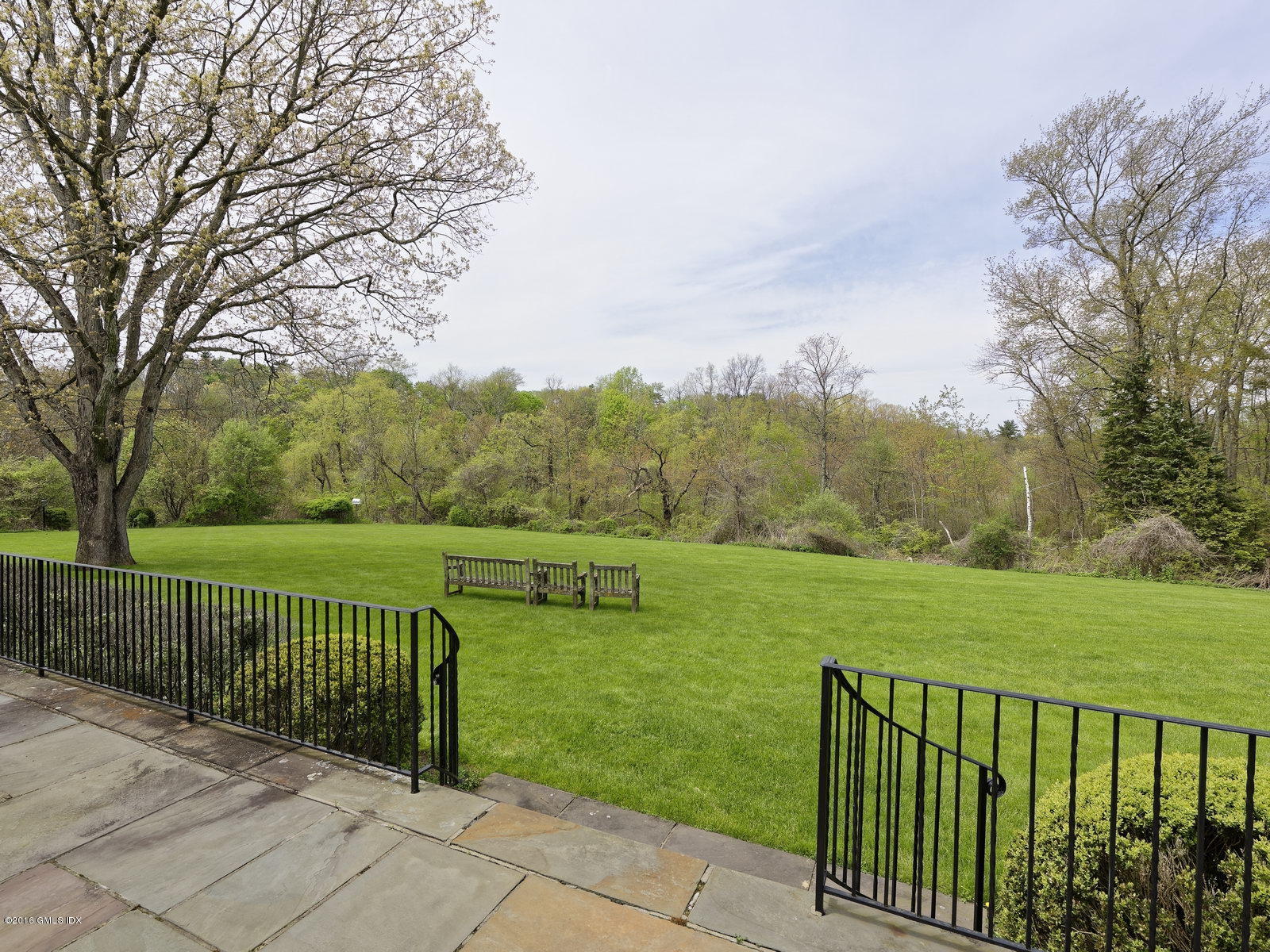 29 Lindsay Drive Greenwich, CT 06830 - Photo 15 of 17 a view of a park and trees with wooden fence