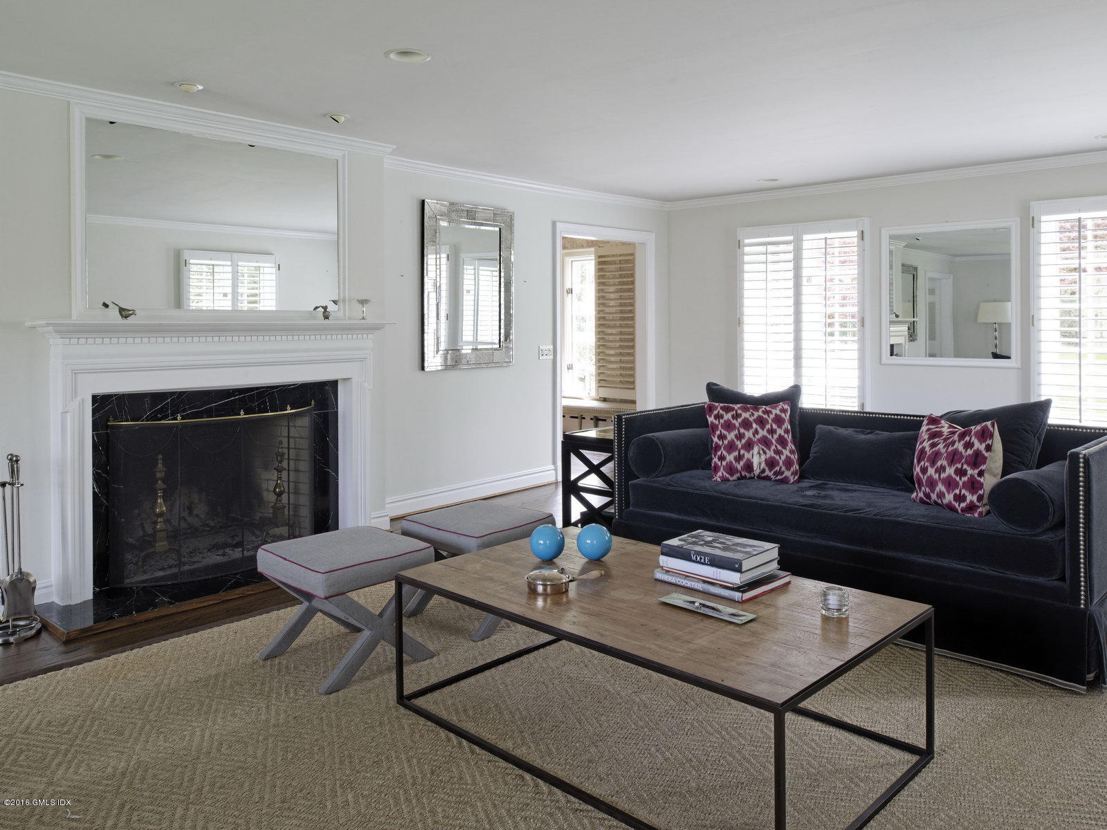 29 Lindsay Drive Greenwich, CT 06830 - Photo 5 of 17 a living room with furniture a fireplace and a window