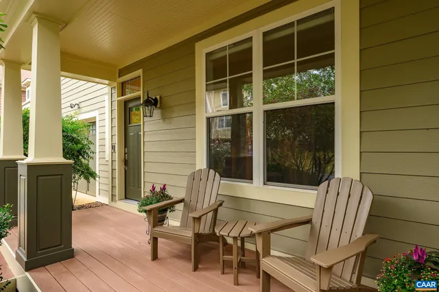 a balcony with table and chairs