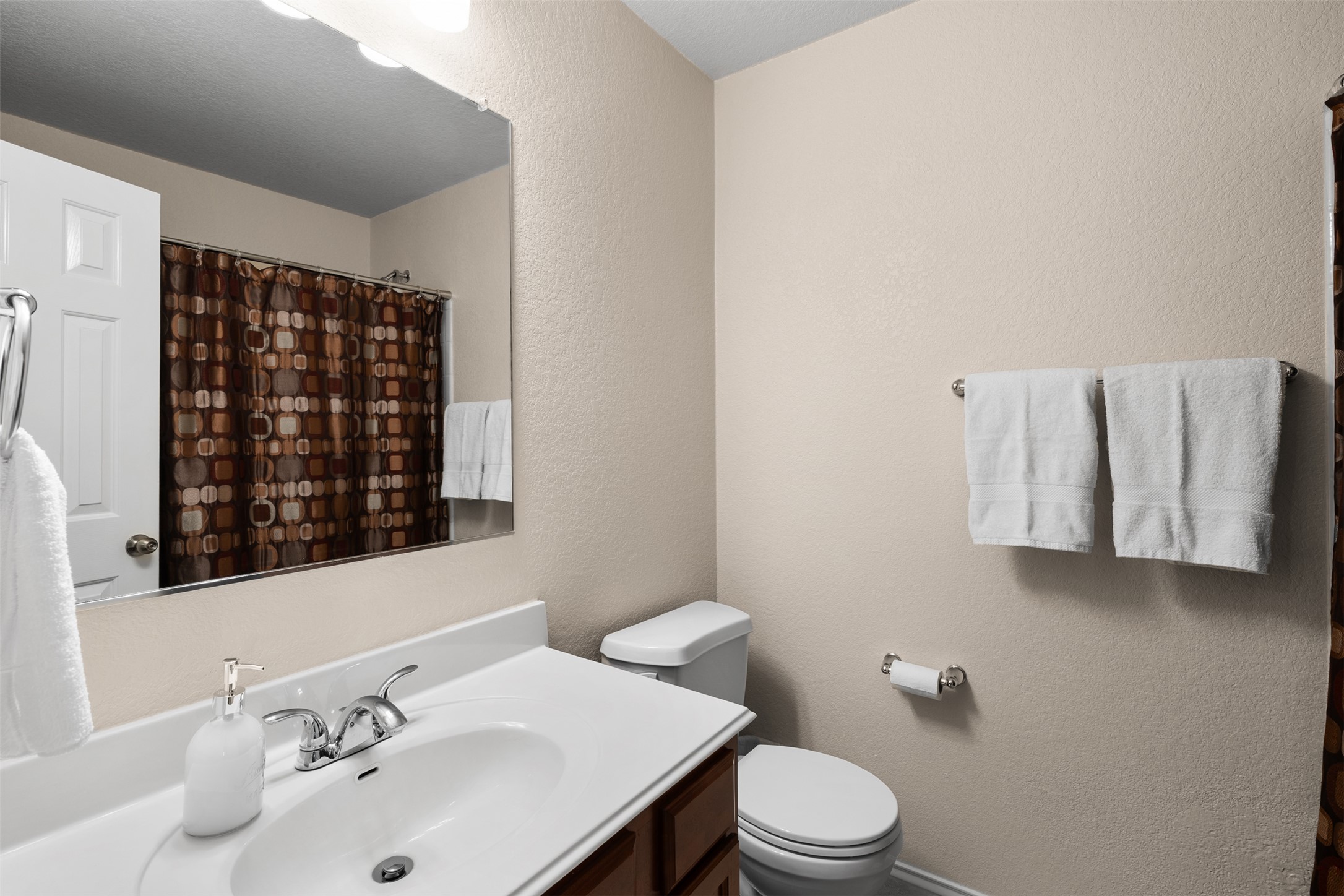 137 Barn Owl Loop Leander, TX 78641 - Photo 29 of 36 a bathroom with a sink a toilet and shower