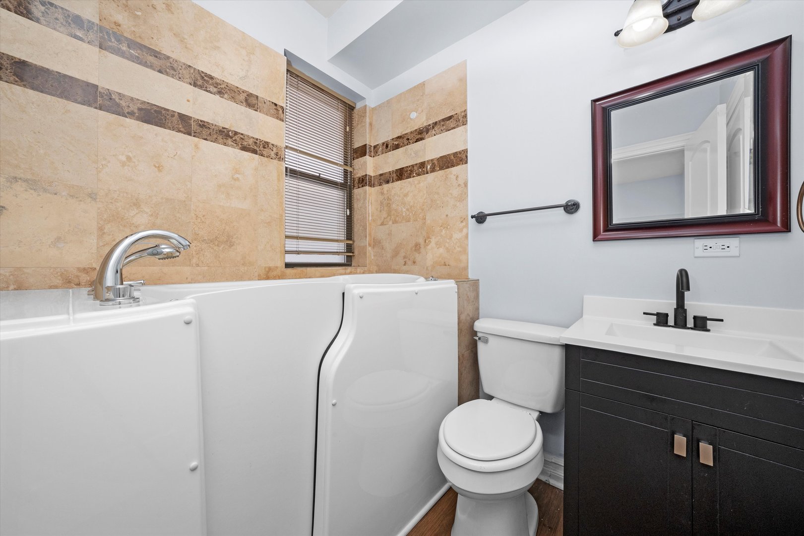 1363 East 64th Street, Unit 1 Chicago, IL 60637 - Photo 13 of 39 a bathroom with a toilet sink and mirror