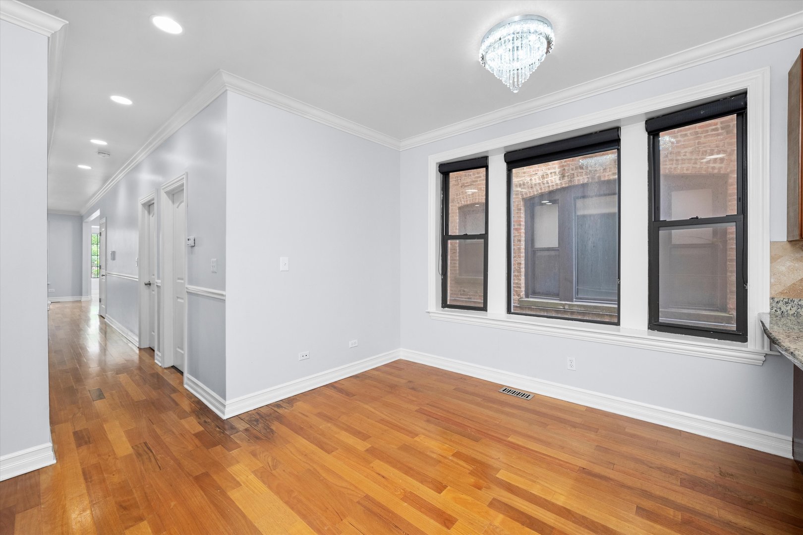 1363 East 64th Street, Unit 1 Chicago, IL 60637 - Photo 21 of 39 a view of an empty room with a window