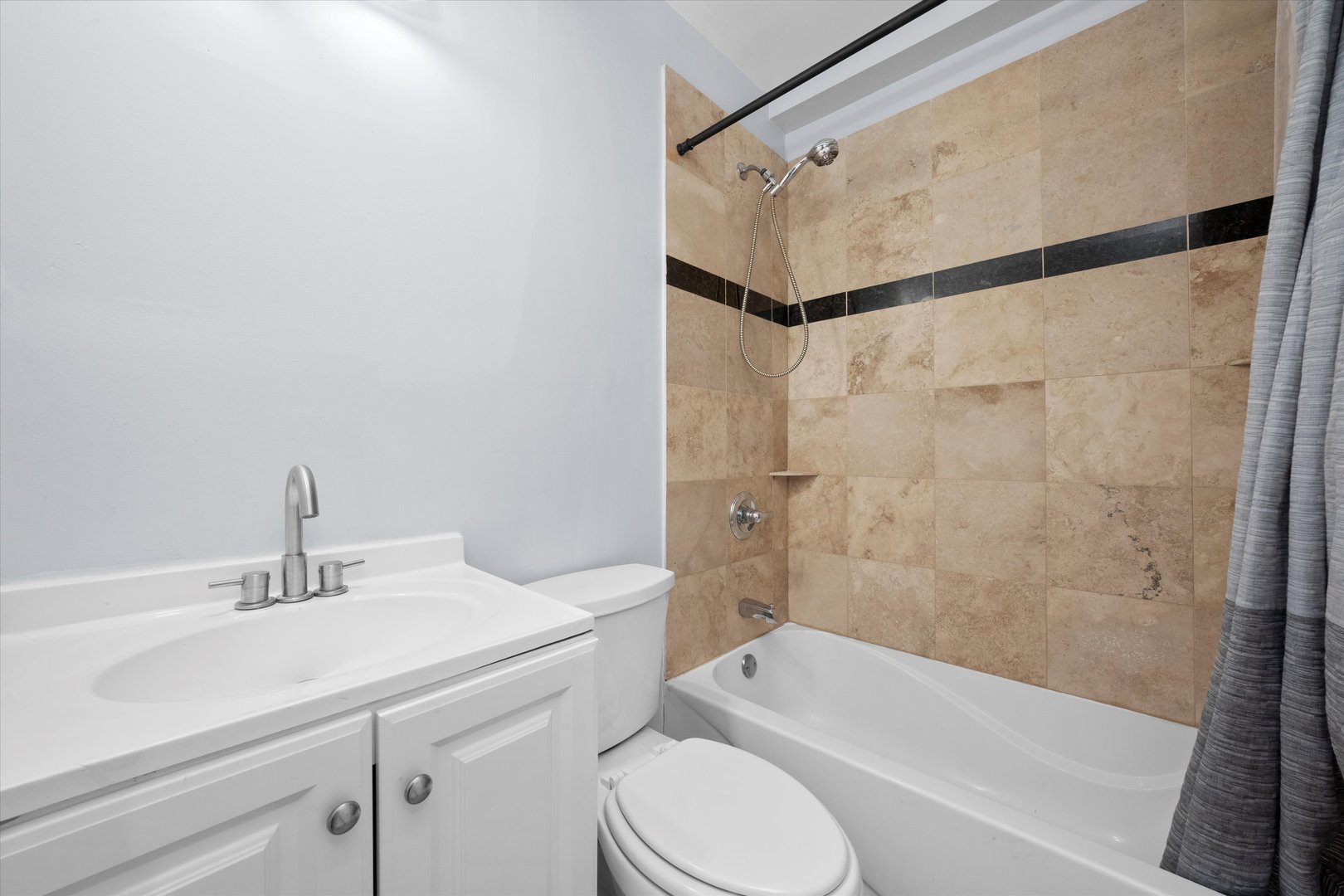 1363 East 64th Street, Unit 1 Chicago, IL 60637 - Photo 24 of 39 a bathroom with a sink toilet and shower
