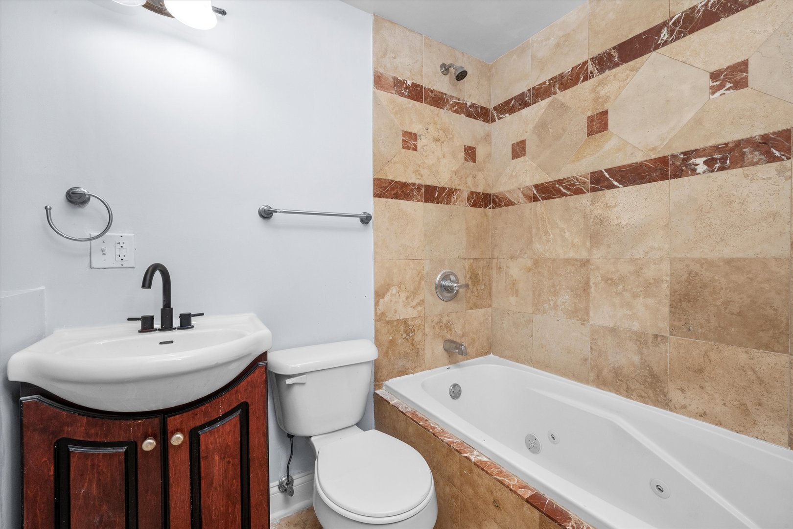 1363 East 64th Street, Unit 1 Chicago, IL 60637 - Photo 25 of 39 a bathroom with a sink toilet and shower