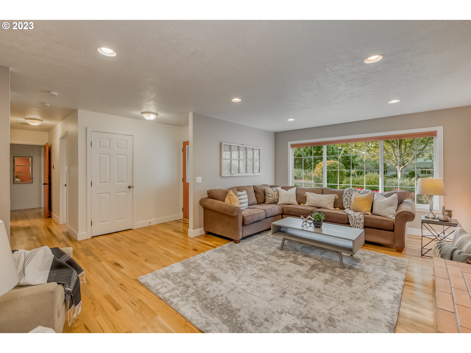 22600 Southwest Riggs Road Beaverton, OR 97078 - Photo 5 of 36 a living room with furniture and a large window