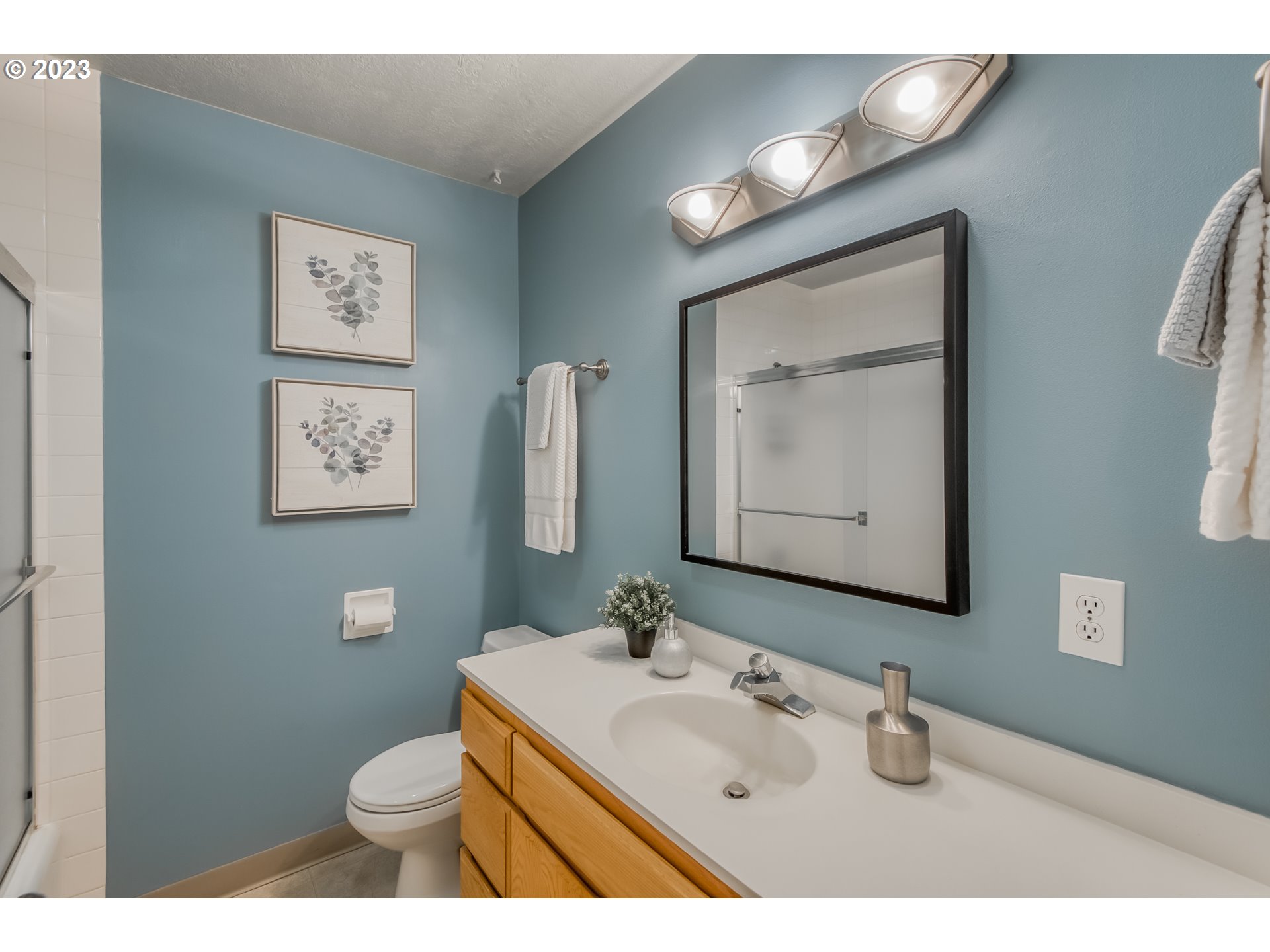 22600 Southwest Riggs Road Beaverton, OR 97078 - Photo 8 of 36 a bathroom with a toilet sink and mirror