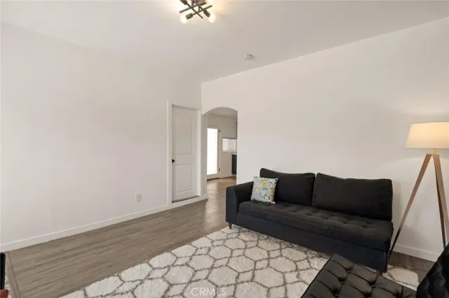 a living room with furniture and a rug