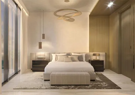 a bedroom with a bed wooden floor and view of bathroom