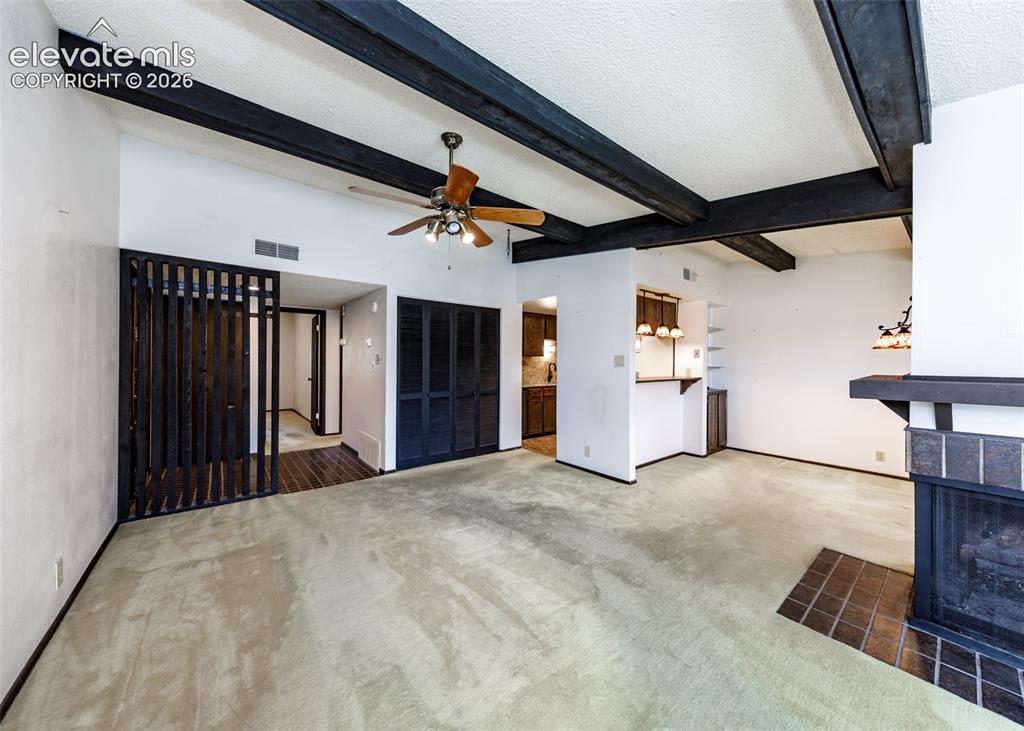 1034 Fontmore Road, Unit D Colorado Springs, CO 80904 - Photo 9 of 43 a view of a hallway with wooden floor and stairs