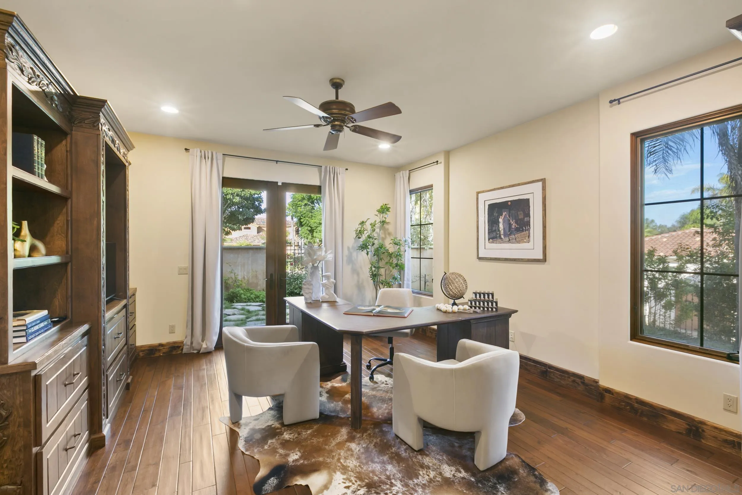 6089 Avenida Alteras Rancho Santa Fe, CA 92067 - Photo 16 of 23 a dining room with furniture a chandelier and wooden floor