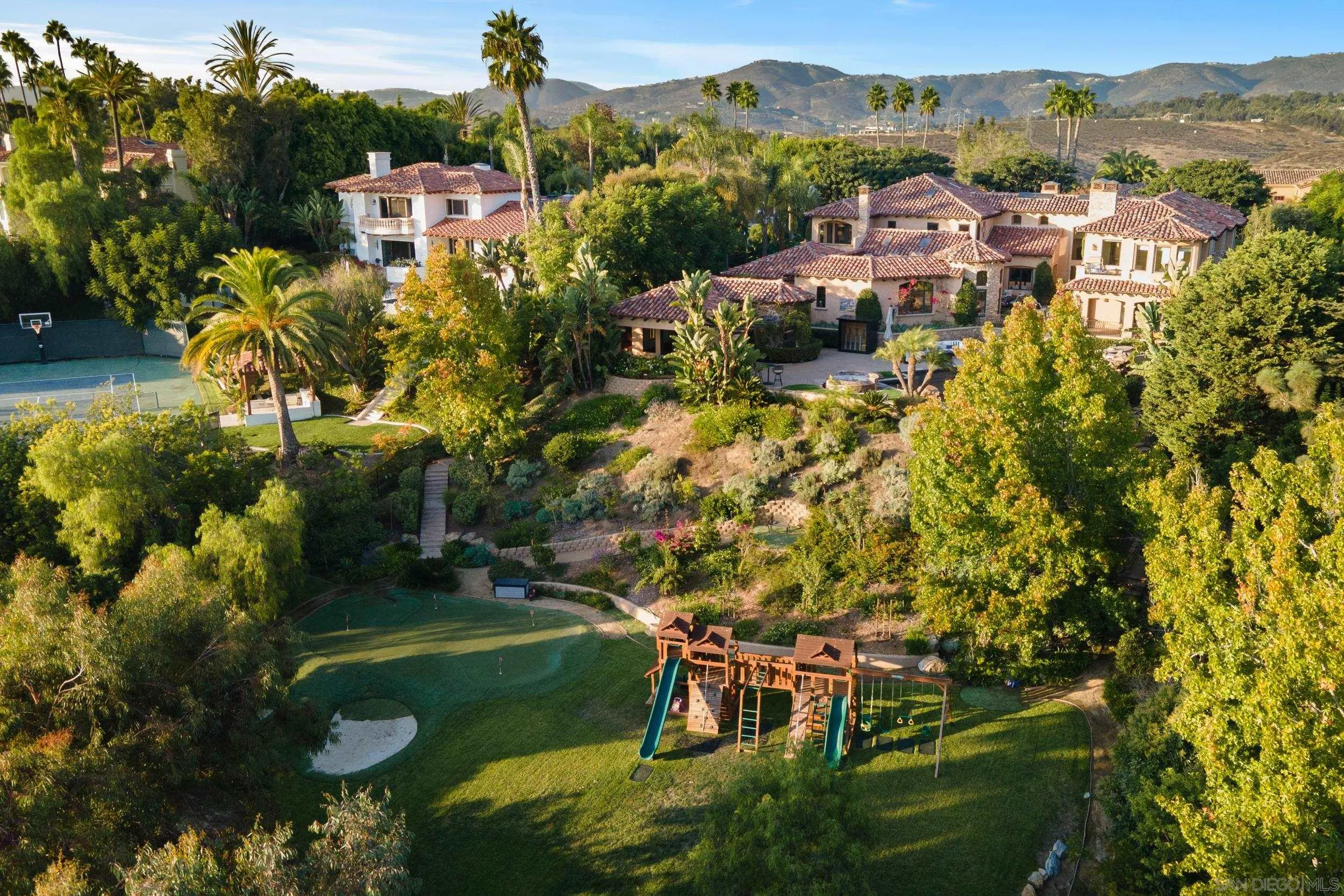 6089 Avenida Alteras Rancho Santa Fe, CA 92067 - Photo 20 of 23 a view of a garden with a building in the background