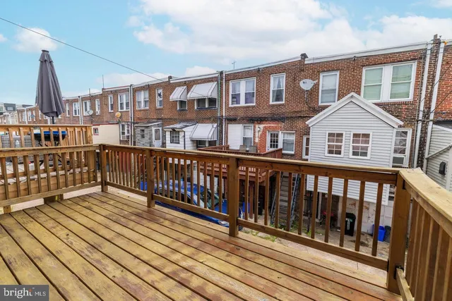 a bedroom with a bed and chair