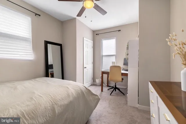 a bedroom with a bed and a dresser