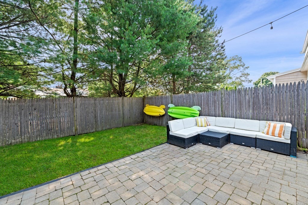 40 Pickwick Road Marblehead, MA 01945 - Photo 5 of 32 a view of outdoor sitting area with chairs and wooden fence