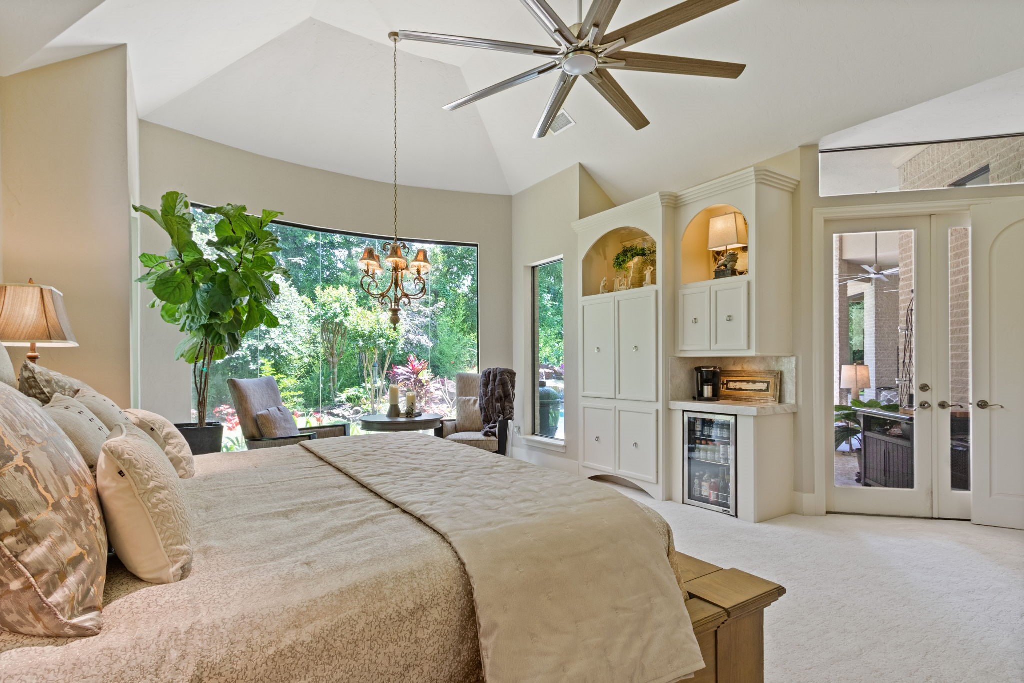 17511 Seidel Road Tomball, TX 77377 - Photo 25 of 49 a bedroom with a bed a window and a chandelier