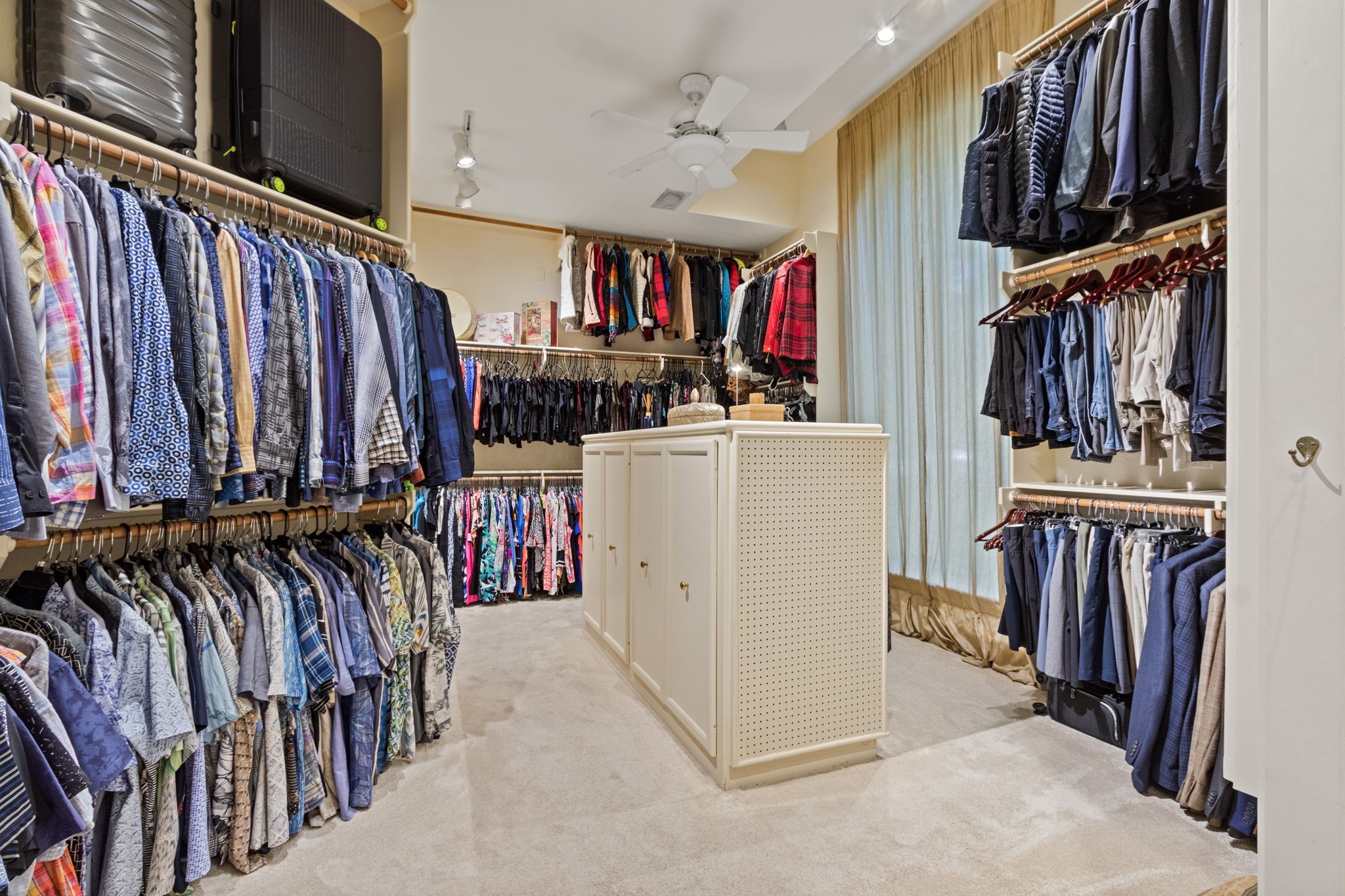 17511 Seidel Road Tomball, TX 77377 - Photo 30 of 49 a view of walk in closet with clothes and shoes