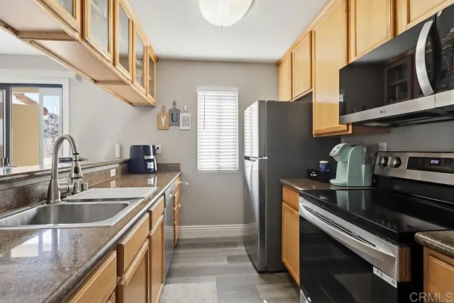 a kitchen that has a sink and a stove