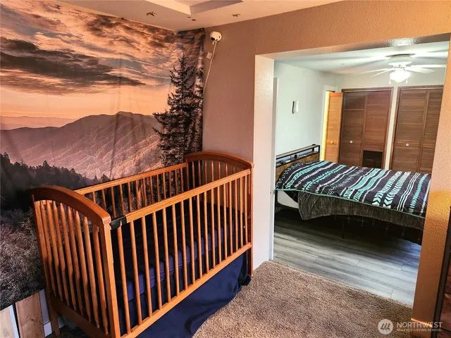 a view of a balcony with a chair and wooden floor