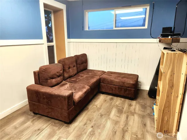 a living room with furniture and a rug