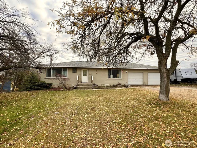 a house with trees in the background