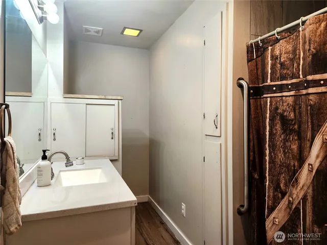 a bathroom with a sink and a mirror