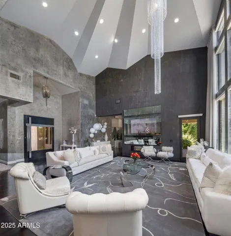 a dining room with wooden floor a glass table and chairs
